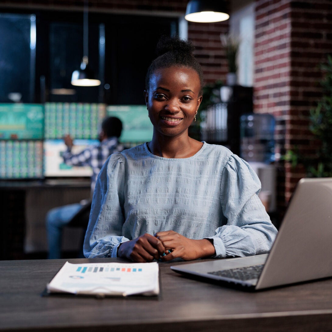 A Data Analyst, or Methodologist, sitting at her work desk