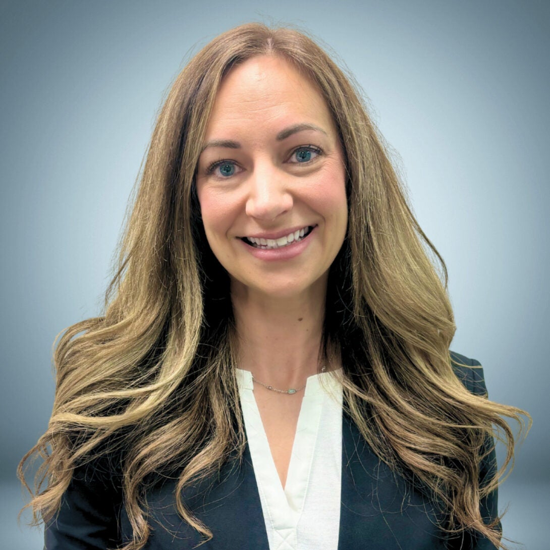 UIC MESA Faculty member, Dr. Sarah Schnabel, smiles in blazer